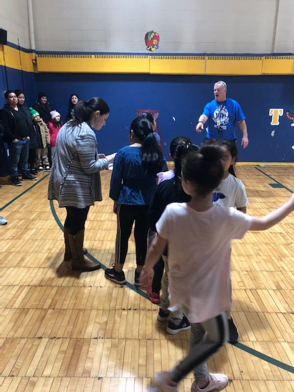 Photos depicting children playing at Number Three School Family Fitness Night